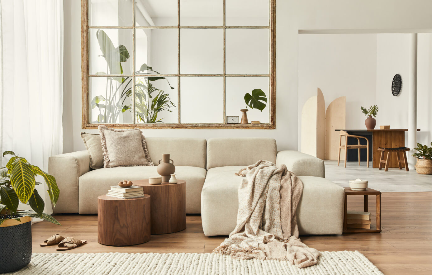 Interior of a modern front room with white couches and wood accents